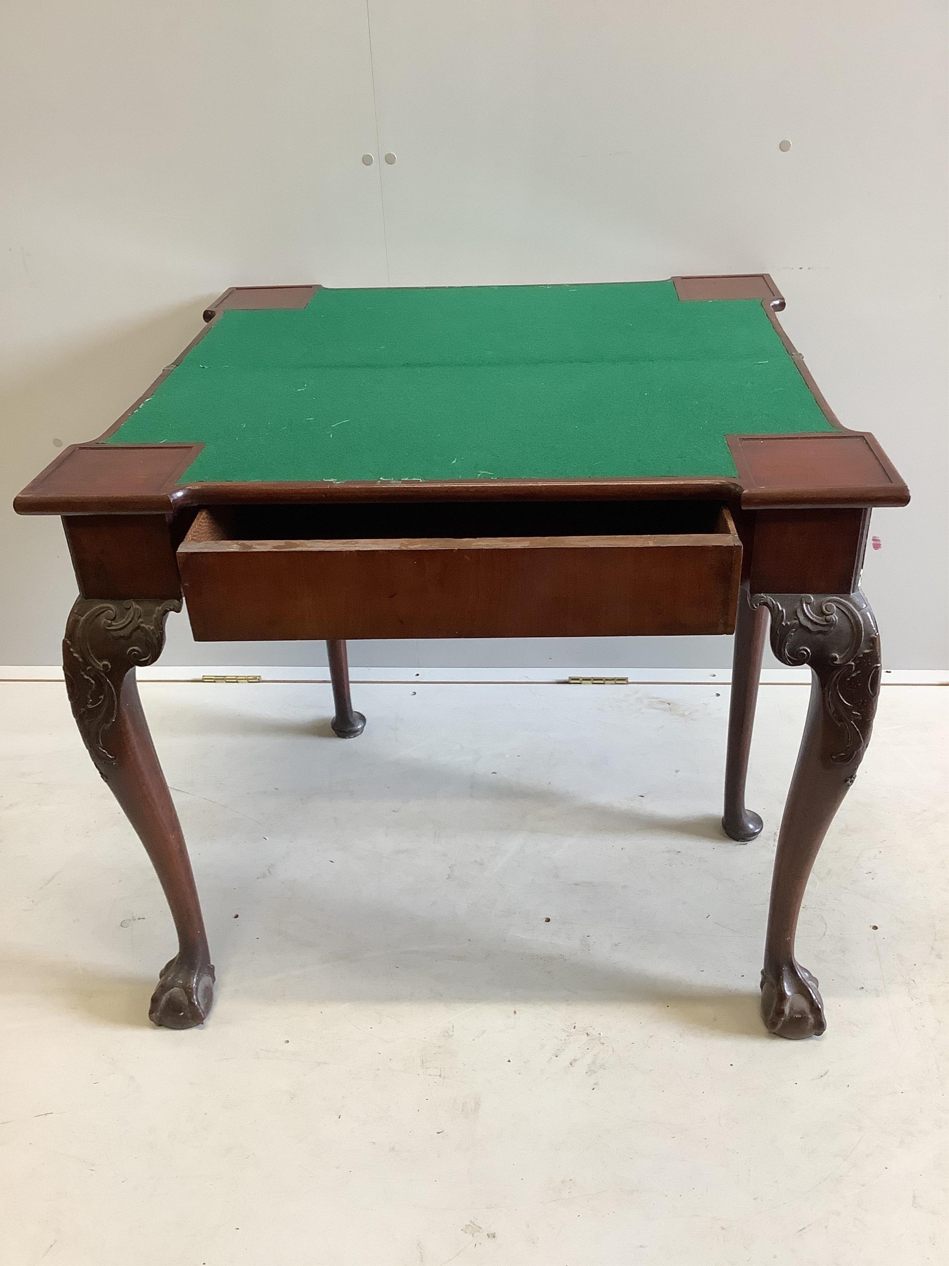 A George II mahogany folding card table, width 83cm, depth 41cm, height 74cm. Condition - fair